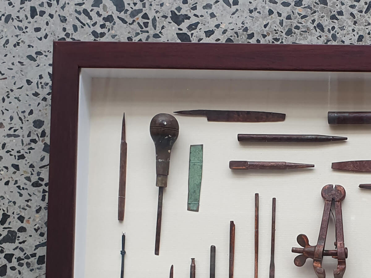 Frame corner close-up of old rusty tools