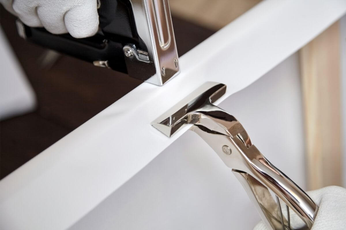 Canvas stretching tool and staple gun
